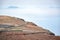 Voulcanic scenic landscape on Lanzarote island and narrow asphalt road along ocean shore and rocks, Canary islands, Spain