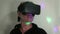 VR: Man in dim room reacts to VR experience with retro lighting effect