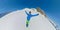 VR360: Freerider pumps his arms overhead while snowboarding down scenic mountain