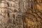 Vranjaca cave wall stone panel with stalactites and stalagmites in Croatia photo