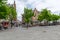 Vrijdagmarkt Friday Market Square with tourists seating on terraces in the historic city center of Gent,Belgium