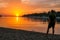 Vrsar - A young man enjoying the sunset by the beach