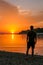 Vrsar - A young man enjoying the sunset by the beach