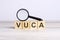 VUCA word made with wooden blocks. can be used for business, marketing and education concept