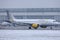 Vueling Aircraft taxiing on Munich Airport, MUC snow