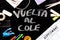 Vuelta al cole text in spanish, meaning back to school, with covid19 face mask on desk with calendar saying septiembre-september