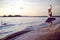 Vulnerable And Sensual Japanese Ballet Dancer in Black Tutu And Silver Crown Posing Near Seashore During Ballet Pas in Summertime