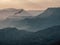 Vulture flies over the evening mountain valley