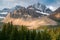 Vulture Peak towers aboveBow Lake in Banff National Park, Canada, lit by few rays of light under dramatic clouds. Cloudy summer