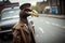 vulture in a retro suit on a city street. generated by AI
