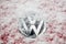 VW Car logo under snowflakes