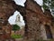 Vyborg. View of the Clock Tower through the window of the destroyed house.