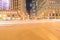 Wacker Dr street with tall buildings and street light trails in Chicago at night