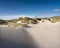 wadden islands have many deserted sand dunes uinder blue summer sky in the netherlands