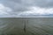 Wadden Sea landscape in the northern Netherlands near Den Oever with windbeaten ocean and an expressive cloudy sky