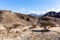 Wadi Shawka riverbed in Hajar Mountains, with oasis, ghaf trees, acacia trees and plants, UAE.