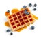 Waffle with caramel syrup and blueberries