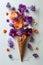 A waffle cone overflowing with a vibrant assortment of edible flowers on a white background