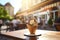 A waffle cone with vanilla ice cream and chocolate drizzle, served on a sunny street-side cafÃ© table