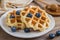 Waffle with fresh blueberry on plate and honey dipper