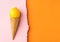 Waffle ice cream cone with fresh lemon on dutone pink orange paper background with torn edge. Styled image mockup flyer poster