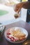 Waffle pancake desert with vanilla ice cream, fresh strawberry and honey syrup