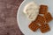 Waffle pretzels with cream cheese on a plate