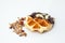 Waffles with chocolate, nut and granola white background.