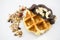 Waffles with chocolate, nut and granola white background.