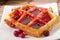 Waffles with cranberry syrup