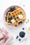 Waffles with cream cheese and fresh blueberries, healthy food, breakfast. Waffles with berries