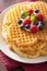 Waffles with creme fraiche and berries for breakfast