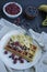 Waffles with fresh banana, raspberries, blueberries for breakfast. Belgian waffles. Dark wooden background