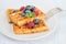 Waffles, raspberries, blueberries and honey