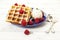 Waffles, raspberries, ice cream on blue plate