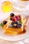 Waffles with sour cream, berries