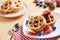 Waffles with strawberry and blueberry and caramel sauce