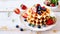 Waffles with syrup and berries