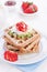 Waffles with wholewheat flour and fruits on a white plate