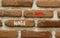 Wage gap symbol. Concept words Wage gap on beautiful brown brick wall on a beautiful brown brick wall background. Business,