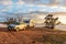 Wagin, Australia - Mar 13,2021: A large white caravan and modern 4WD vehicle free camp next to the nearly dry salt Lake Norring