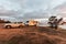 Wagin, Australia - Mar 13,2021: A large white caravan and modern 4WD vehicle free camp next to the nearly dry salt Lake Norring