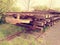 Wagon with extracted old railways. Concrete and wooden sleepers with rail rods