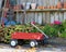 Wagon, Petunias, Fallen Leaves, and Clay Pots in Autumn