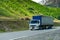 Wagon transports cargo on a mountain road in a picturesque place