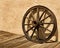 Wagon Wheel Wheel Against a Stucco Wall in Arizona