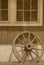 Wagon whell by barn