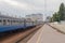 Wagons in a train station and an empty platform