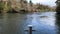 Waikato River flowing gently passed the boat anchor capstan