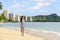 Waikiki beach Hawaii travel tourist woman relaxing walking on sand at sunset on famous beach stretch in Honolulu summer